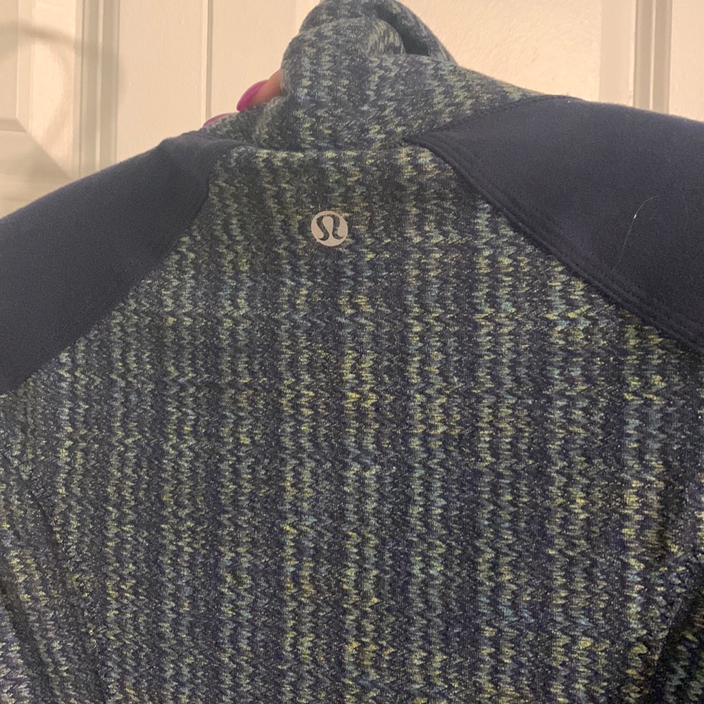 LULULEMON navy blue and green fitted zip up. Has original elastic on zipper.